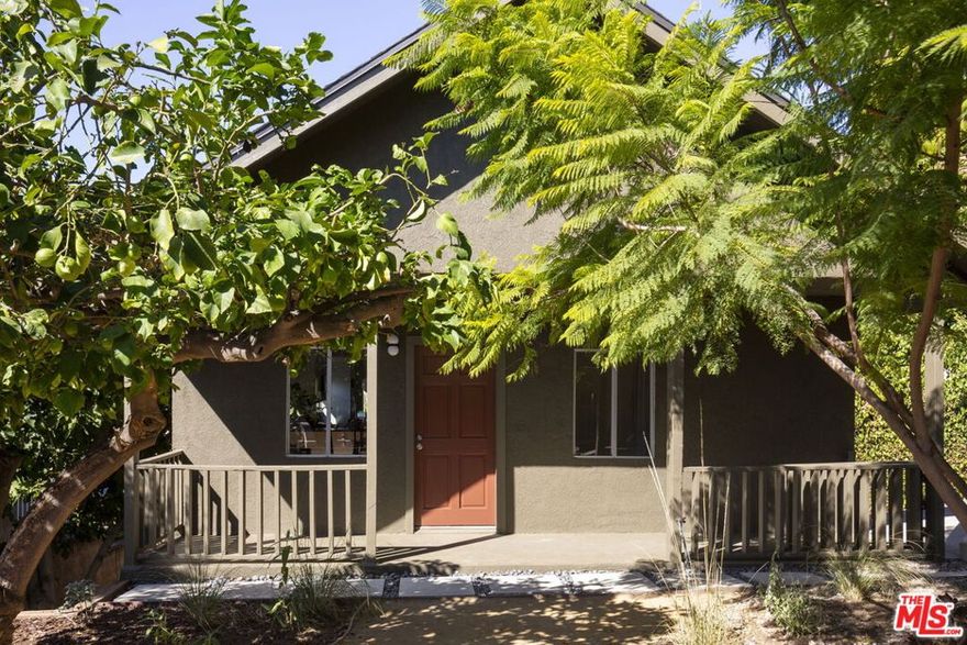 Nestled against the hills in Cypress Park, this charming bungalow offers a serene retreat with sweeping hill and Griffith Observatory views. Tucked away on a quiet street and secluded behind a gate, the home is enveloped by native grasses, a flowering jacaranda, and mature citrus, creating a peaceful oasis. The welcoming front porch is a perfect spot to enjoy your morning coffee.Inside, the home showcases original moldings around doors and windows, adding to its character and charm. Generous windows flood the space with natural light, enhancing the open and efficient layout. The home's flow leads seamlessly to the backyard, where you can take in the views or host dinner parties. The primary bedroom features an ensuite bathroom with classic yet updated finishes.The property includes a large driveway for ample parking, a generous backyard with drought-tolerant landscaping, including mature cacti. The home features essential updates like a newer roof, HVAC, and a new foundation. When not enjoying your home, head out to enjoy many of the amenities close by including coffee at Little Barn Coffee (just half a mile away), wine at Barra Santos or head to the Rio De Los Angeles State Park or revitalized LA River to enjoy some nature. If you are looking for a charming bungalow with views in a central location, this is your spot! This bungalow is a true gem for those seeking charm and views in a central Los Angeles location!