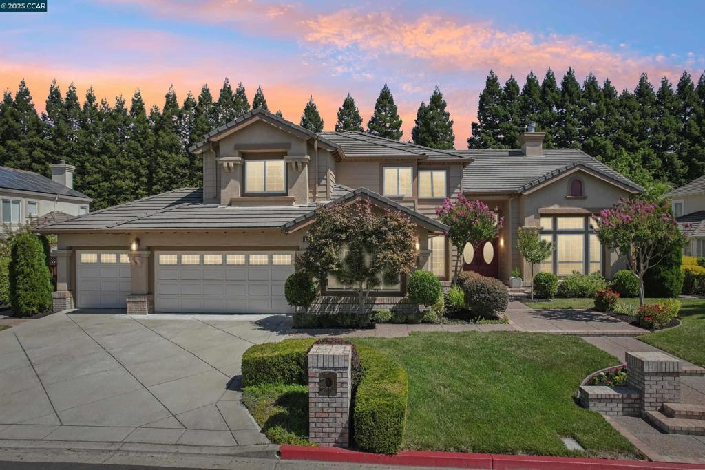 Located in the highly desirable and private enclave of Victoria Place, this impressive residence offers over 4,100 sq. ft. of elegant living space with 5 bedrooms & 4 bathrooms — with an owned solar system for energy efficiency & cost savings. Step inside to a grand entry with a sweeping staircase and formal sunken living room showcasing soaring 30-foot ceilings and a dramatic gas fireplace. The adjacent formal dining room is highlighted by designer chandeliers and light fixtures, perfect for entertaining. The expansive chef’s kitchen features a large center island with prep sink, premium appliances including a Thermador range, and flows seamlessly into the spacious great room with direct access to the backyard. A luxurious downstairs primary suite offers abundant natural light, a spa-inspired bathroom, and a generous walk-in closet. An additional downstairs bedroom with full bath makes an ideal guest retreat or private home office. Upstairs, you’ll find large bedrooms, add'l baths, plus an inviting bonus room — a perfect media room, gym, or secondary gathering space. The backyard is an entertainer’s dream, boasting a sparkling pool and spa, mature landscaping, and multiple areas to relax and host gatherings. Fantastic schools,perfect location, this one checks all of the boxes!