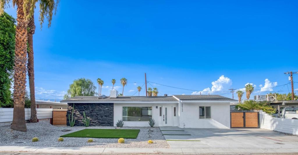 Welcome to this elegant mid-century modern home, beautifully nestled in the sought-after Cathedral City Cove neighborhood. Built in 1954, this 4-bedroom, 3-bath architectural gem has been thoughtfully upgraded and remodeled to today's standards while retaining its timeless appeal. Currently used as an annual rental, it offers both income potential and a beautifully updated residence to enjoy.The open floor plan is filled with natural light, featuring a sleek fireplace in the living area, dining space, and a fully remodeled kitchen with Whirlpool appliances, quartz countertops, oversized sink, ample cabinetry, and a central island. Upgrades include dual skylights, luxury vinyl flooring, LED lighting, Pex plumbing, new switches/receptacles, and energy-efficient windows. A brand-new top-of-the-line Trane variable-speed HVAC system with a 10-year warranty ensures year-round comfort.All bathrooms have been fully redone with modern fixtures, and the spacious primary retreat boasts a walk-in closet, spa-like ensuite, and direct backyard access. Outdoors, enjoy turf grass, a firepit, and plenty of space for entertaining--all framed by gorgeous mountain views.A true mid-century treasure and a fantastic opportunity for investors or owner-occupants alike.