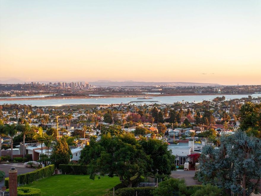 A once-in-a-generation opportunity on .97 acres in the coveted Kate Sessions / Mount Soledad enclave. This elevated lot offers jaw-dropping panoramic views of the ocean, bay, downtown skyline, and nightly SeaWorld fireworks.   The possibilities are exceptional: create a landmark legacy estate, explore a lot split under SB 9 or traditional subdivision (buyer to verify feasibility), or reimagine the existing residence.  The property features two existing curb cuts, providing valuable design flexibility, and includes preliminary architectural plans for a 10,000+ sq ft custom home.  One of only eight parcels of this scale in the Kate Sessions area, this is a rare chance to secure a commanding view property in one of San Diego’s most sought-after neighborhoods. Just minutes to La Jolla, the beach, and top-rated schools—this is coastal living at its highest potential.
