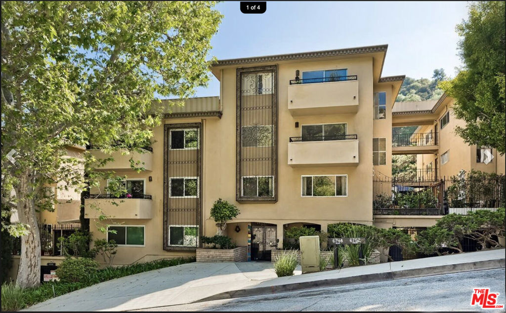 This spacious penthouse home spans 1,118 square feet with no shared walls, is a corner unit and features a balcony with views of nature, lots of greenery AND your own expansive private outdoor patio. Internet and water are included. Can be furnished for higher rate. Designed by renowned Architect of the Stars, Paul R. Williams, this property is in the Hollywood Hills, located higher on the hill near Mulholland Drive and north of the Hollywood Bowl. Living here offers a peaceful sanctuary surrounded by views of the rolling hills and boasts an abundance of natural light flowing through expansive windows, with the open-concept living and is perfect for relaxing, entertaining, and enjoying sweeping canyon breezes. This is your personal oasis. Inside, you'll find new flooring, fresh paint, smooth ceilings and a convenient all-in-one washer/dryer unit. Carpet is a very high end wool blend. The kitchen is equipped with sleek quartz countertops as well as ample cupboards and a large pantry. There are 2 ovens and a griddle along with 4 burners and broiler. The layout includes a generous primary bedroom suite, featuring wall to wall closets. In the primary bathroom area is a linen closet, a built in clothes hamper, built in cupboards with shelves book casing the sink and a vanity with seven drawers to put all your personal items in. There is a formal dining area, a breakfast bar for five to sit at, a large living area, and a bonus nook ideal for a home office, reading space, or creative studio. Thoughtful updates complement the original architectural charm.There is a nice foyer when you walk in and just off of that, you'll find a beautiful separate powder room for your guests.- The complex is close to 14 acres with an impressive list of community amenities: 2 swimming pools, spa, tennis court, pickleball court, gym with two areas, 4 saunas and a recreation room with kitchen, pool table and ping pong table!- Enjoy access to two dedicated side-by-side parking spaces in a gated garage. There is plenty of non-permit parking on this quiet street for guests.- Situated in a peaceful community with easy access to the 101 freeway, Downtown, the Hollywood Bowl, major studios, and scenic hiking trails, this home offers a rare blend of style, comfort, and location. Location is just north of the Hollywood Bowl