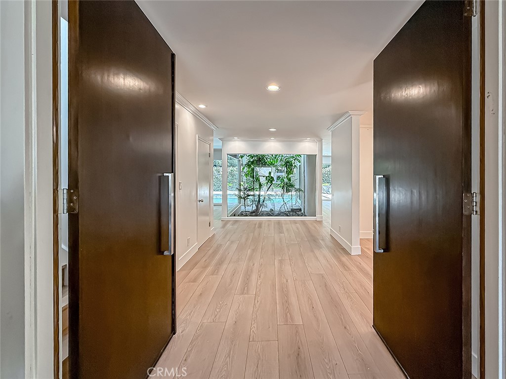 This beautifully remodeled two-story home offers the perfect blend of comfort, space, and convenience in one of Encino’s most sought-after neighborhoods. Situated on a quiet cul-de-sac south of Ventura Boulevard, the property is within the highly regarded Lanai Road Elementary school district, making it an ideal lease opportunity for families seeking both location and lifestyle.
With over 3,400 square feet of living space, the home provides a thoughtfully designed layout featuring four bedrooms and three bathrooms. The expansive primary suite is privately situated, offering a relaxing retreat with 2 over sized walk in closets and an en-suite bathroom. Three additional bedrooms provide flexibility for family, guests, or home office use.
The main living areas showcase an open concept design that creates an effortless flow between spaces. The large living room is filled with natural light, anchored by wide windows that highlight views of the backyard and pool. Adjacent is a formal dining area, perfectly suited for entertaining, while a spacious family room provides additional options for everyday living.
Recently completed updates enhance the home’s character while delivering a fresh, contemporary feel. Brand-new flooring throughout, updated bathrooms with modern fixtures, and a full interior paint refresh create a clean and inviting backdrop ready for immediate move-in. The home maintains its classic Encino charm while integrating the conveniences of modern design.
The kitchen, designed for both function and style, includes abundant cabinetry, generous counter space, and easy access to both indoor and outdoor dining areas. Whether preparing meals for family or entertaining guests, the space supports a seamless lifestyle.
Outdoor living is a highlight of this property. The private backyard is designed for year-round enjoyment, featuring a sparkling pool, large patio, built-in BBQ, and mature landscaping that offers both shade and privacy. It’s an inviting space for gatherings, relaxation, or quiet evenings at home.
Located just minutes from Ventura Boulevard, the home is close to Encino’s best dining, shopping, and entertainment options. Easy access to the 101 and 405 freeways provides a quick connection to the Westside, the Valley, and beyond. With its combination of size, updates, and prime location, this residence offers a rare lease opportunity in one of Encino’s most desirable settings.