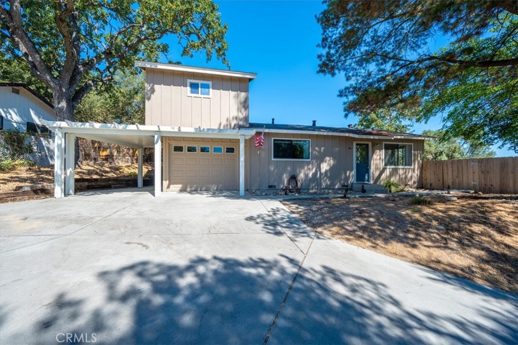 Welcome to this charming three-bedroom, two-bath home in Atascadero, offering over 1,600 sq. ft. of comfortable living on a generous 15,000 sq. ft. lot. The private, fenced backyard is perfect for relaxing or entertaining, with scenic views and a built-in barbecue for warm evenings. Step inside to a large, cozy family room with tile floors and a wood-burning stove—a perfect gathering space for family and friends. The separate front-entry living room is filled with natural light and offers lovely views of the yard. The well-maintained kitchen features tile countertops and easy access to the backyard, making meal prep and entertaining a breeze. The updated primary suite is a true retreat, boasting a custom tile walk-in shower, barn-style door, and a spacious bathroom with a separate closet. Downstairs, two additional guest bedrooms share a full bathroom, along with a bonus room that can serve as a TV room, office, or play space. This home combines comfort, style, and a convenient location just minutes from downtown Atascadero, offering the perfect blend of privacy and accessibility. Don't miss your chance to make it yours!