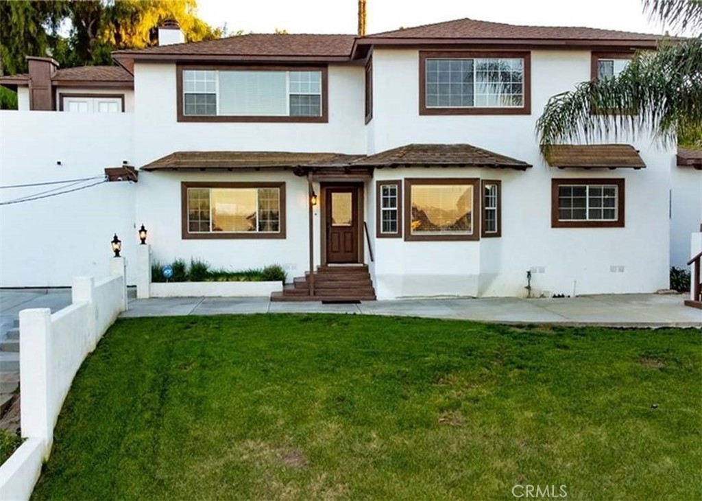 Welcome to this custom home with exquisite views nestled in Vista. Located minutes away from Hwy. 78 and only shy of 11 miles away from the beach.!!! This spacious 3,206, 5 bedroom 4 bath home is perfect for a large family. With two solar systems included, tile flooring, updated kitchen and baths. A newer A/C unit also 3 bedrooms conveniently located downstairs, this home is one of a kind. Not to mention, no HOA and low taxes!!!!Come and check out the VIEWS!