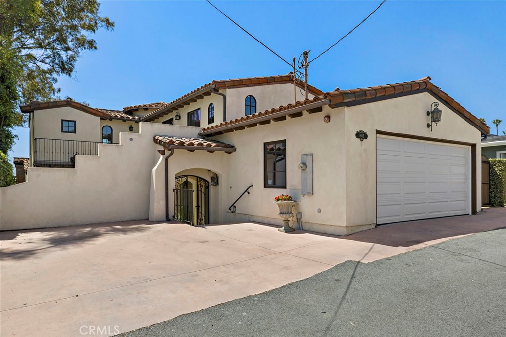 Live the San Clemente lifestyle in this beautifully updated Spanish-style residence, just a short stroll to the beach and a golf cart ride away from Del Mar street. Featuring a private gated courtyard, charming wrought iron details, arched doorways, and rich wood finishes throughout, this home seamlessly blends classic character with modern comforts. Enjoy expansive living and dining areas with beamed ceilings, a cozy fireplace, and abundant natural light from custom windows and French doors. The gourmet kitchen boasts stainless steel appliances, a large center island, and timeless cabinetry. With spacious bedrooms, spa-inspired baths, and serene outdoor spaces, this home is ideal for relaxing or entertaining. Don’t miss the opportunity to live close to top restaurants, shops, and surf in one of South Orange County’s most desirable beach towns!