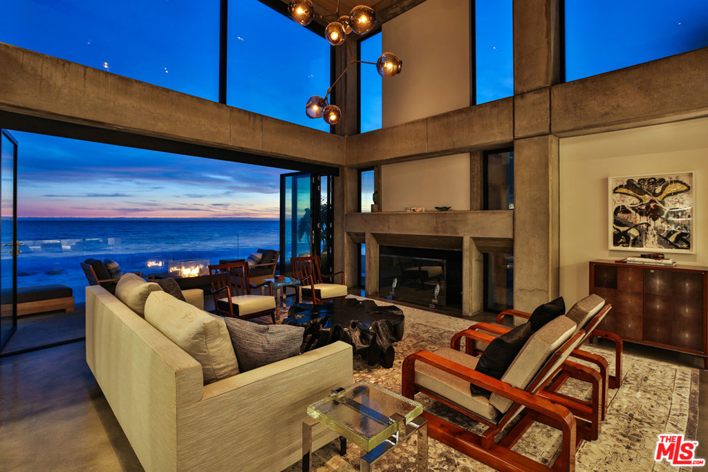 Recently renovated, state of the art oceanfront modern located on Las Flores Beach offering dramatic 180 degree ocean and city lights views. With no expense spared, this multi-level property features a main floor great room and high-end finishes including custom natural rift white oak stairs, designer kitchen with caesarstone countertops, and retractable walls of glass all opening out to the expansive oceanfront decks. Complete with an abundance of living space, dramatic fireplace, and numerous outdoor entertaining areas, this home boasts 3 bedrooms, oceanfront office with trundle bed and 4 spa like bathrooms which feature either custom Bisazza tiles, Quartzite or Onyx counters. Top-level amenities include a programmable and customizable window shades and AV system and much more. This property is the ultimate indoor/outdoor Malibu lifestyle for your most discerning client.