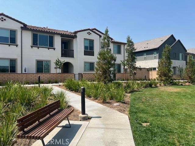 The floor plan is thoughtfully designed, featuring one bedroom and a full bath on the main level- perfect for guests or a home office. Upstairs, you’ll find two additional bedrooms and full bathrooms that offer privacy and comfort. The main living area has great views and looks out onto lush green space and the San Gabriel Mountains, not into another unit, offering a sense of openness and tranquility.
As part of a well-maintained HOA, you’ll enjoy access to resort-style amenities including multiple swimming pools, a clubhouse, BBQ areas, fire pits, a dog park, and a fitness area complete with pickleball and basketball courts.
Inside the home, everything is brand new, including a Samsung refrigerator, Samsung washer and dryer, Whirlpool gas stove, and Whirlpool microwave. The private tandem garage easily fits two vehicles. Solar panels are already installed, and the lease is fully covered by the owner to help lower your electricity costs. HOA dues are also paid by the owner. Tenants are responsible for water, gas, electricity, and Wi-Fi utility fees.
Small pets are welcome with a security deposit. Smoking is not permitted. All applicants will be subject to a credit, background check and Zoom interview. Security deposit required.
Convenience is another key highlight- Costco, 99 Ranch Market, Target, Stater Bros, restaurants, and shopping centers are all just minutes away. School District: Park View Elementary, Grace Yokley Middle, and Colony High School.