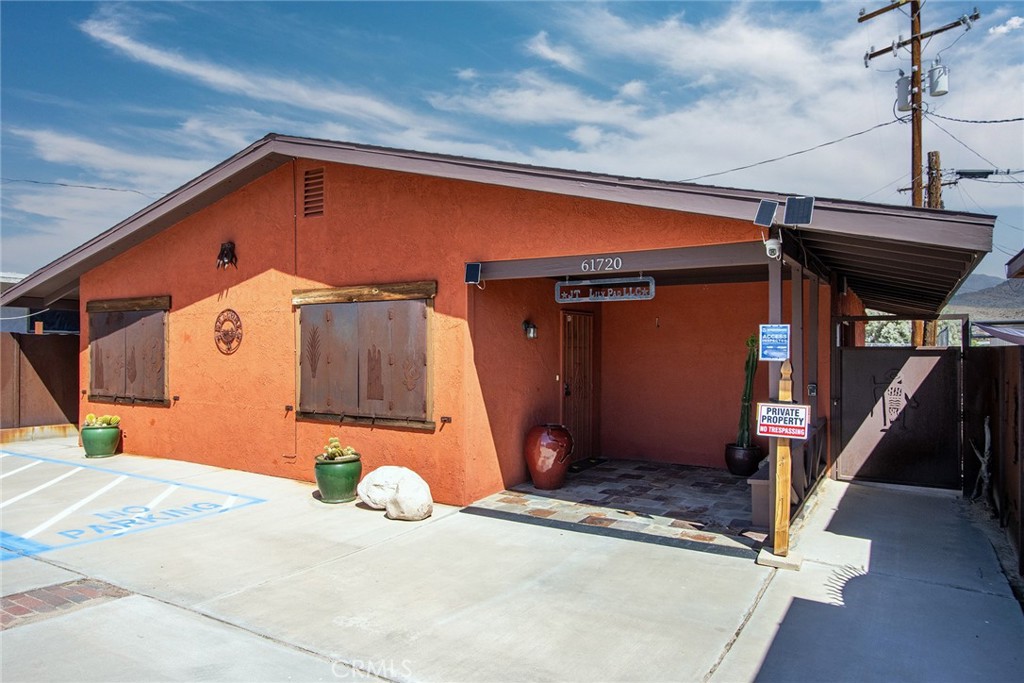 Commercial Building Downtown Joshua Tree. Located on Commercial St, one block off Hwy 62, near the center of town. Building and Parking Lot has been completely updated and remodeled. ADA compliant interior and exterior. For many years, the building housed a well-respected veterinary clinic. More recently, it was purchased by a retired Toyota executive, who completely remodeled the premises. Once it was remodeled, the location was used as an international executive coaching business. Automotive executives from the top global manufacturers traveled to Joshua Tree. The desert helped get executives out of the comfort zone of their corporate offices and back in touch with the reality of consumers' desires, to improve customer loyalty for higher market share and improved profitability – all of which was successfully accomplished in this little-known Joshua Tree commercial location. The current owner of the property has now retired after a 40+ year career, making it available to purchase as a front or back business operation. While seemingly modest in size, many huge business goals have been achieved at this location and many new opportunities exist for potential future owners.