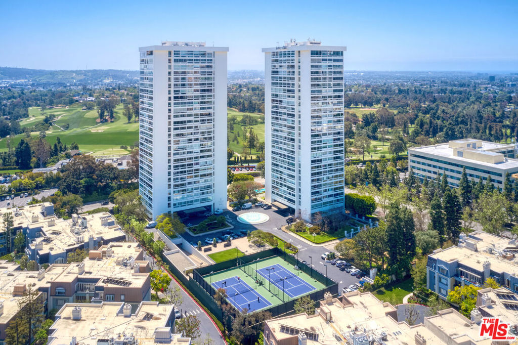 VIEW, VIEW, VIEW! Incredible lease opportunity at Century Towers Residences. This stunning condo in a prestigious gated community, just below the penthouse, offers panoramic views of Los Angeles, Beverly Hills, Century City, the Hollywood Hills, and the golf course. Featuring a spacious living room, large balcony, hardwood floors, washer/dryer inside, and a brand-new refrigerator, it feels like a vacation at home. Includes two side-by-side parking spaces with storage. Enjoy resort-style amenities: an elegant lobby, heated pool, fitness center, tennis courts, sauna, concierge, valet, 24-hour guard-gated entry, and building-wide EV charging stations (8 available). Ideally located near Westfield Century City, Beverly Hills, and world-class dining and shopping. Available furnished or unfurnished. The image has been staged using AI technology.
