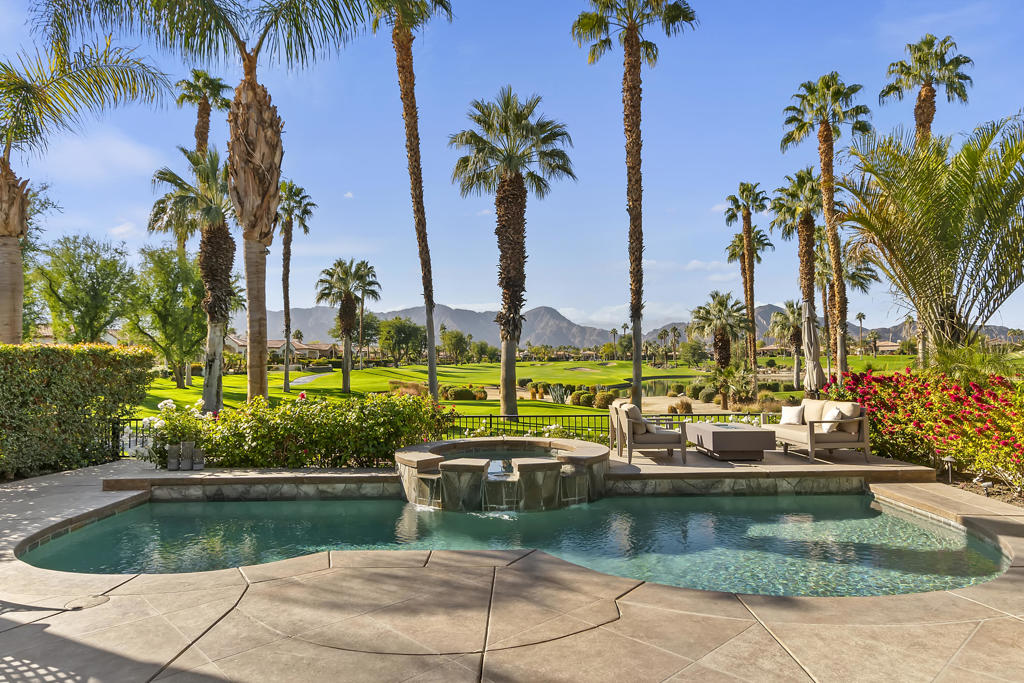Mountain and Lake views! This desirable south west facing Encanto 1 home has views that seem to go on forever! The upgrades and additions create your own private resort with 3 bedrooms, (all king beds) and ensuites. The beautifully furnished and comfortable great room comes complete with built in bar and large screen TV. A well-appointed chef's kitchen, includes an island for food preparation. The beautiful back yard with pool and spa showcases a relaxing lifestyle overlooking three holes of the Steve Pate course. Relax and unwind on your expansive deck while views of the Santa Rosa mountains wash your cares away! This beautiful home has been meticulously cared for by its owners. Utilities are capped at $250. per month. Includes wifi and cable TV! Please call for available dates!