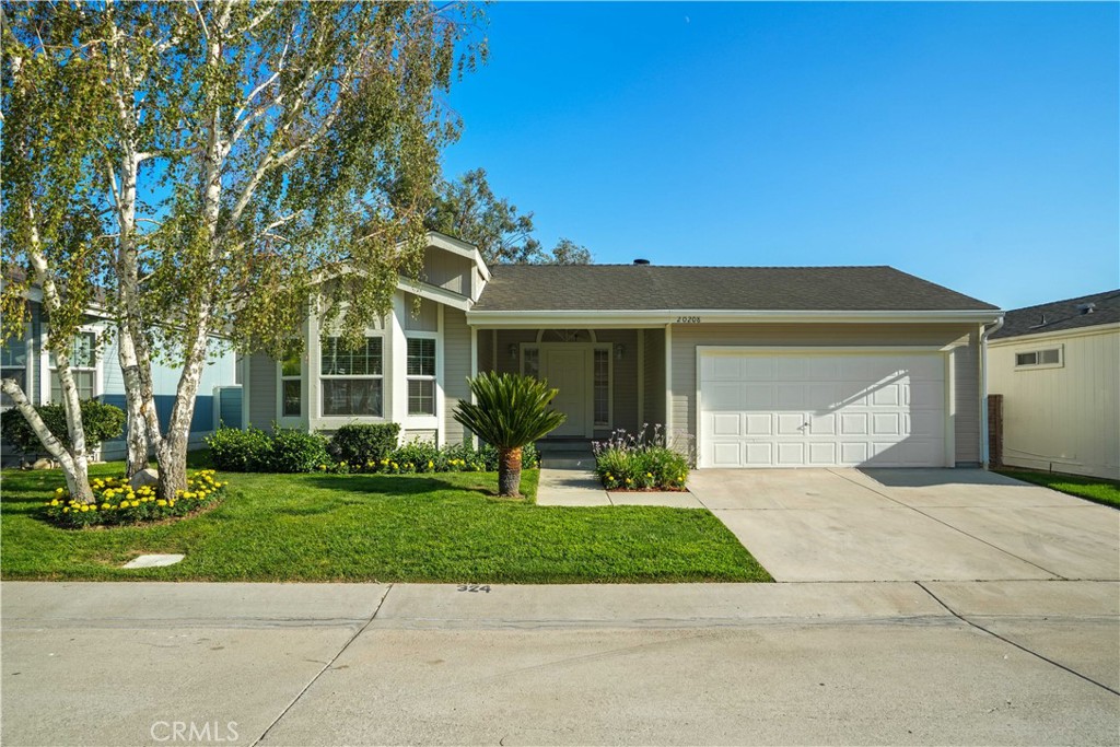Welcome to this beautifully updated 2-bedroom, 2-bathroom home offering 1,311 square feet of comfortable living space. Enjoy fresh interior and exterior paint, brand-new luxury vinyl plank flooring, and plush new carpet in the bedrooms. The inviting living room features a cozy fireplace—perfect for relaxing evenings. The bright, functional kitchen includes white cabinetry and a central island with refinished countertops—ideal for both everyday use and entertaining. Ceiling fans are installed throughout the home for year-round comfort. Step outside to a spacious backyard oasis featuring a large patio, beautiful planters, a grass area, and an incredible mountain view—perfect for outdoor dining, relaxing, or play. Additional highlights include a direct-access 2-car garage and a layout designed for both style and convenience. This move-in-ready home combines comfort, charm, and scenic surroundings—don’t miss your chance to make it yours! This home is located in Canyon View Estates and has a current monthly land lease of $1,886.22 which includes community amenities such as a 24-hour gate, usage of 2 pools and spa, 2 sport courts, and 2 play areas. Canyon View also offers a community clubhouse and RV storage. The home is located near parks, bike & walking paths, shopping & entertainment, and schools, with easy freeway and Metro-link access. Home is a must-see! Please submit pre-approval along with proof of funds with offer. Buyer to verify all before close of escrow.