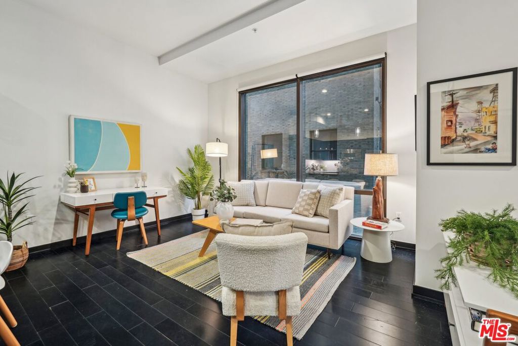 Perched in the heart of DTLA, this sleek urban retreat blends effortless style with just the right amount of drama. Floor-to-ceiling windows showcase striking views of the Roosevelt Loftsan Italian Renaissance icon rebornframing your daily backdrop in architectural history. Inside, rich dark wood cabinetry, granite counters, and stainless steel appliances bring understated sophistication to the open kitchen, while a spacious breakfast bar sets the stage for slow mornings or late-night bites. The bedroom area is generous and smartly tucked away, with an oversized walk-in closet and a full bath that keeps things simple and chic. Dark wood floors, in-unit laundry, and a parking space check all the boxes. Set within 655 Hopea boutique, 80-residence emerald tower with Art Deco flairresidents enjoy access to a rooftop lounge with sweeping skyline views, a well-equipped fitness center, game room, and 24-hour attended lobby. Live above it all while staying connected to everything: the Financial District, buzzy restaurants, retail, entertainment, and Metro access just outside your door. ***Most utilities are included + 1 unassigned parking space.***