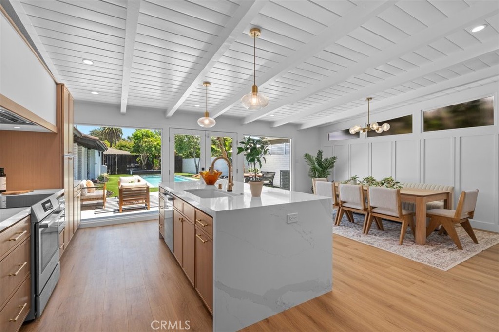 Welcome to this reimagined mid-century modern home, located in the highly sought-after Los Cerritos/Virginia Country Club neighborhood. This completely renovated 4-bedroom, 3-bathroom residence combines timeless design with contemporary upgrades, offering style, function, and comfort in every detail. At the heart of the home is a beautifully redone pool, serving as a stunning centerpiece visible from the kitchen, dining room, and primary suite through expansive windows—bringing in natural light and seamless indoor-outdoor flow. Inside, you'll find a thoughtfully updated interior with a fully remodeled kitchen boasting custom cabinetry, huge island, new appliances, and sleek fixtures. Bathrooms have been tastefully modernized, and additional upgrades include new interior doors, flooring, fresh paint, a designated laundry area, and an added fourth bedroom. Comfort is enhanced with a new A/C system, new windows, upgraded electrical panels, new plumbing, and improved attic and wall insulation.
Just a short walk to the prestigious Virginia Country Club and golf course, Rancho Los Cerritos, dining, shopping, parks, and award-winning schools, this home perfectly blends luxury, functionality, and community. A rare and remarkable opportunity.