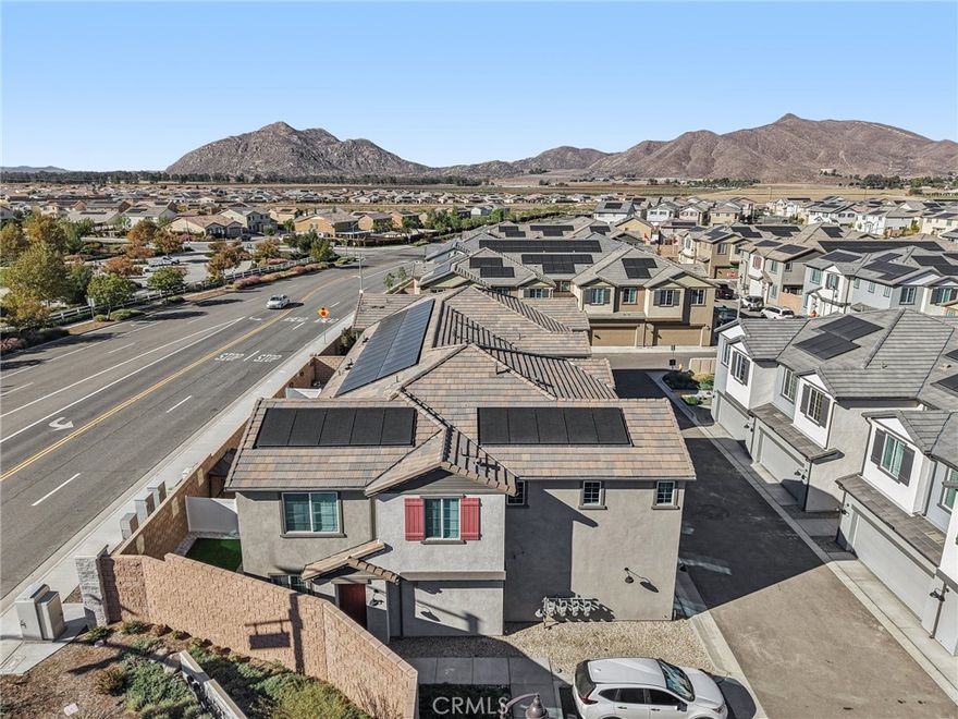 This beautiful end-unit home offers modern comfort, great natural light, and an open floor plan ideal for today’s lifestyle. Enjoy your own private patio with low-maintenance artificial turf—perfect for outdoor dining or relaxing. The attached two-car garage and leased solar system add convenience and energy efficiency. Inside, the main level features vinyl flooring, an open-concept living and dining area, and a spacious kitchen with granite countertops, stainless steel appliances, a center island, and pantry. A sliding door off the dining area opens to the patio, and a convenient powder room completes the downstairs layout. Upstairs includes a versatile loft, three bedrooms, two bathrooms, and a laundry room. The primary suite offers an en suite bath with dual-sink vanity and walk-in closet. Located in the sought-after Keystone community with access to a clubhouse, pool, basketball and tennis courts, playground, and soccer field. Close to schools, shopping centers, and dining options.