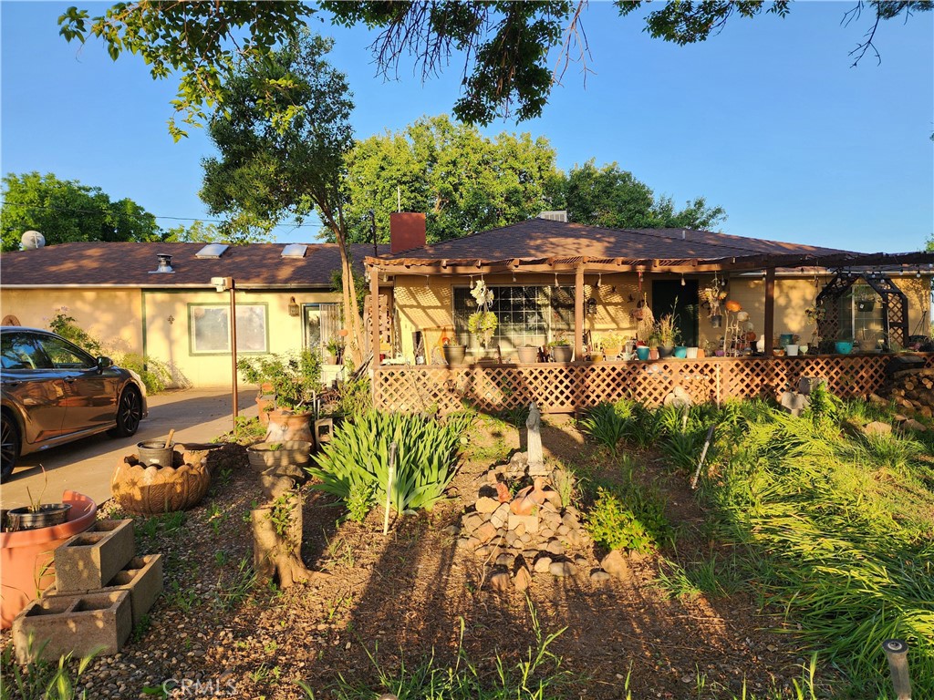 Tranquil 2-Acre Property Home and Bonus Guest! Plenty of tall, shady trees for both front and back yards. Side yards and a welcoming centrally located middle yard. Great for kids and/or picnics. Both roofs new 2 years ago. Front deck of main house rebuilt and back deck reinforced in 2019. Main home is a 4/2.5 with a bonus room. Central air/heat. Large family room with wood stove, living room with wood stove, kitchen and dining rooms. Shaded back deck for relaxing or barbecues. The guest is an updated manufactured 3/2. Central air/heat. Dining room, kitchen, living room and 2 bedrooms with full bathroom. Master bedroom with its own full bathroom. Laminate floors, newer interior paint. Front porch. Back deck is rebuilt also in 2019. Parking for both and paved RV parking area at main house. If you are looking for privacy, come see this unique property. Schedule an appointment today! Text preferred.