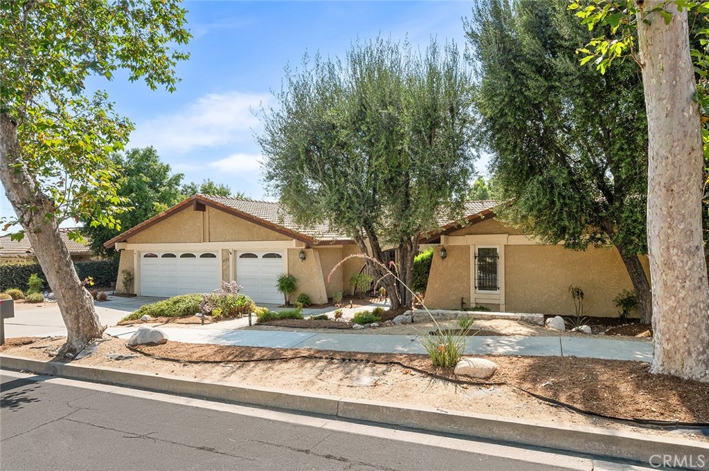 Step into this exquisite single-story home nestled in the charming city of Claremont, CA, where every detail exudes elegance and sophistication. This 4-bedroom, 2-bathroom residence sits on a sprawling 11,215 square foot lot, offering a serene retreat from the hustle and bustle of everyday life.
As you enter, you are greeted by a spacious living room adorned with a cozy fireplace, perfect for relaxing evenings. The formal dining room features a slider that opens to the expansive backyard, creating a seamless indoor-outdoor living experience. The family room overlooks the remodeled kitchen, boasting custom cherry wood cabinets, luxurious Taj Mahal quartzite countertops, and top-of-the-line Whirlpool appliances.
The home is filled with custom upgrades, including LVT wood-look flooring, a Tiffany-style chandelier, and custom alder wood cabinetry in the hall and main bath. The bathrooms showcase curbless tiled showers with temperature-controlled flow and water-conserving fixtures, adding a touch of modern luxury.
Outside, the xeriscape front yard is a masterpiece of landscaping design, complete with drip irrigation and a clever rainwater collection system. An Alumawood pergola extends off the patio, providing the perfect spot for outdoor dining and relaxation.
Located near prestigious schools, scenic hiking trails, and convenient freeway access, this home offers the best of Claremont living. Immerse yourself in the vibrant community with its farmer's markets, local shops, and charming eateries, all while enjoying breathtaking views of the foothills and mountains.
This home is truly move-in ready, offering a perfect blend of comfort and style. Don't miss out on this amazing opportunity to make this stunning property your own and experience the best that Claremont has to offer.