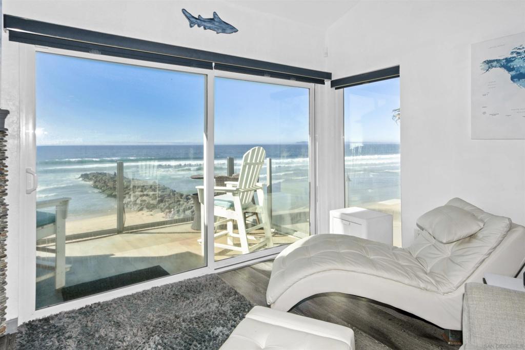 Available Long Term or Short Term- Furnished Beach Front Condo! This stunning 2-bedroom, 2-bathroom apartment offers a truly unique living experience with its unbeatable location and breathtaking ocean views. Step out onto your private balcony and soak in the beauty of the Pacific Ocean right at your doorstep. With a 1-car garage, parking will never be an issue. This beachfront home is the perfect choice with laundry in unit and much more!