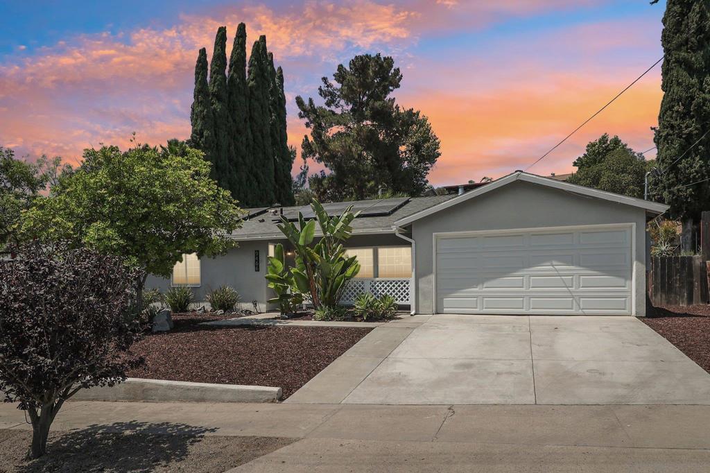 Welcome to this charming and move-in ready 3 bedroom, 2 bathroom, single-level home featuring stylish new flooring throughout and fresh interior paint that brings a modern, clean feel to every room. The spacious layout includes a large sunroom—perfect for a home office, personal gym, playroom, or a bright space to entertain while enjoying views of the private backyard. Money saving assumable solar. Attached 2 car garage with additional driveway parking. Located just minutes from the 52 and 125 freeways and close to Mission Trails Regional Park, Santee Lakes, El Cajon Mountain, West Santee Schools, shopping, dining, and more.