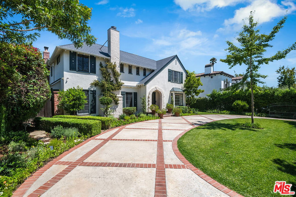 Elegantly poised on a quiet street in a coveted neighborhood sits this charming 2-story traditional estate. Enveloped by natural sunlight, this gated property with circular drive features 5 bedrooms, 5 and a half bathrooms, large living room, family room, den, formal dining room and breakfast nook. Each of the 4 spacious bedrooms upstairs have high ceilings and ensuite bathrooms. The downstairs maids room can be used as a room or office. Charming details can be found throughout the home such as wainscoted walls, curved crown molding and French pane windows. Bay windows overlook an extraordinary swimming pool and secluded backyard, ideal for entertaining and al fresco dining. The property also includes a quaint pool house with 2 small rooms and 2 full bathrooms. This home is in great condition with pre-inspections performed! Recent upgrades include a new roof (main house, pool house and garage), new AC units, sky light and more. Ideal for a Buyer looking for a minimal project to unlock this home's true potential!