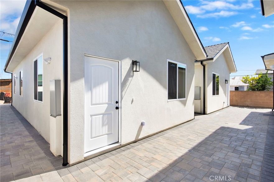 Brand new built never been lived in modern beauty! Step into the spacious and open floor plan with so much attention to detail. Kitchen features European style white oak cabinets with quartz counter tops and backsplash, stainless steel appliances and black accent handles and faucet. Brand new flooring throughout, recessed lighting with dimmers, new doors and dual pane windows. Beautifully remodled bathroom with modern tiles, ugraded vanietes with quartz counter tops, and glass shower enclosures. Home also comes equipped with in unit laundry, central A/C, Solar powered, and privately gated front entrance with motarized gate.