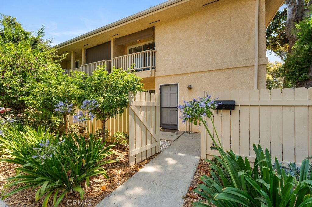 Welcome to this rarely available corner unit townhome in the highly desirable Northridge Village community! Just 2 miles from Cal State Northridge and walking distance to Northridge Hospital, this beautifully maintained 4 bedroom, 2.5 bath home is move in ready and offers comfort, privacy, and an unbeatable location. Located in a gated, park like community with mature trees and lush greenbelts, this corner unit boasts no neighbors on three sides, giving you an extra sense of peace and space. Step through the private, oversized front patio ideal for BBQs, entertaining, or relaxing under the sun and into a spacious living room featuring a brick fireplace and sliding doors that open back to your patio. The separate dining area flows into a recently remodeled galley kitchen, complete with white soft close cabinets, a farm style sink, butcher block countertops, pull out pantry shelves, stylish backsplash, and stainless steel appliances. A sunny breakfast nook with a large window creates the perfect spot to enjoy your morning coffee. A powder room and a large storage closet under the stairs complete the first floor. Upstairs, you'll find four generously sized bedrooms, including a spacious primary suite with his and hers closets, a vanity/office/craft nook, and private balcony access to enjoy fresh air. The ensuite bathroom includes a large window that fills the space with natural light. The three remaining bedrooms share a full hallway bath with tub. Additional highlights include:
Direct access 2 car garage with fresh paint and storage space, Central HVAC, Newer dual pane windows, Laminate hardwood flooring throughout the first floor and Ceiling fans and updated interior doors. Community amenities feature three pools, a clubhouse, playground, plenty of guest parking, security patrol, and beautifully maintained grounds. This home offers the perfect blend of style, space, and convenience a true gem in the heart of Northridge. Don’t miss your chance to call it yours!