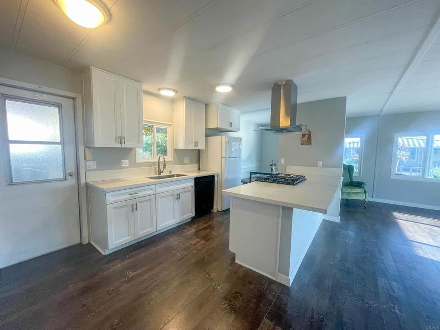 Welcome to the 55+ Rancho San Luis Rey MHP, where rent control and NO PROPERTY TAXES make Unit 345 a smart and affordable choice! This renovated 2-bed, 2-bath 1080 esf home offers a spacious open floor plan perfect for modern living. Relax on the charming covered front porch, or enjoy the privacy of your own backyard space, situated in a prime location at the rear of the park for added tranquility. Rancho San Luis Rey has 433 homes, brimming with resort-style amenities. Boat & RV Parking. Enjoy access to two clubhouses, tennis courts, pools, spas, a billiard room and convenient laundry facilities. For outdoor enthusiasts,  a dedicated dog park, and even a nearby bike path leading straight to the beach. SPACE RENT is $575/month approx (plus utilities). This home offers unbeatable value in one of the most sought-after communities. Don’t miss this opportunity!