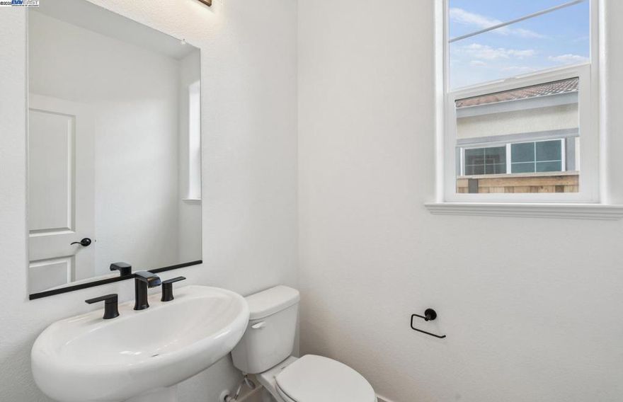 Plan 3 features an open floor plan with covered patio, spacious den and loft, quartz kitchen countertops, white cabinetry, stainless steel Whirlpool appliances and luxury vinyl plank flooring. This beautiful home is adjacent to future community park. *Photos are of model home, not actual home*