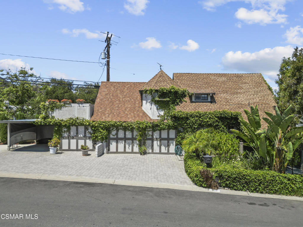 Enchanting & Unique Chateau Retreat in Newbury Park. Step into a world of charm and character with this must see property located in the serene, unincorporated area of Newbury Park. This distinctive 4-bedroom, 3-bath home boasts a one of a kind, design that immediately sets it apart. Inside, you'll find a unique loft perfect for a bedroom, a home office, or creative space, and a primary suite featuring a walk-in closet. Every corner of this home invites comfort and individuality. Enjoy peaceful mornings and starlit evenings from the private rooftop deck. The detached garage has been thoughtfully converted into a fully functional 1-bed 1-bath in-law suite, ideal for guests, or multi-generational living. Whether you're seeking a private sanctuary or a property with income potential, this magical home offers both. Come experience the unique style, quiet setting, and versatile layout in person.