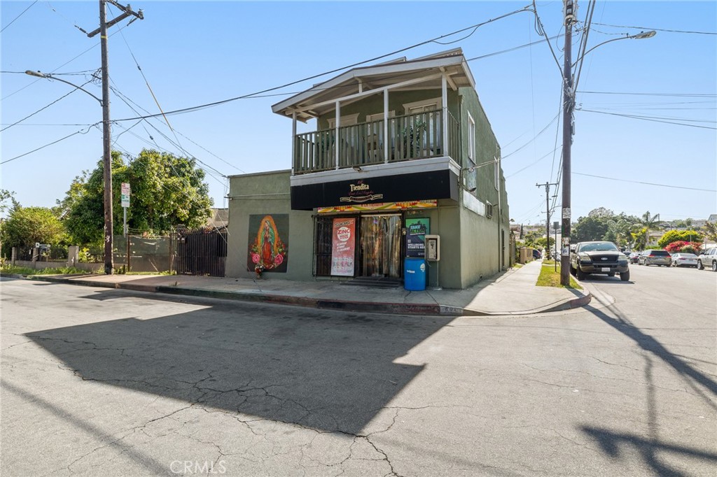 Well-positioned corner-lot mixed-use property featuring a convenience store with a small meat counter on the ground floor, along with two separate 1-bedroom, 1-bathroom apartment units. The upstairs unit includes a private balcony, while the second unit—formerly a garage—has been legally converted with permits. All three units are separately metered, and both apartments operate on month-to-month terms. With bold street visibility and steady neighborhood traffic, this property presents an excellent opportunity for an investor or owner-user. Sale includes inventory: 1 freezer and 2 refrigerators. Contact listing agent for more information!