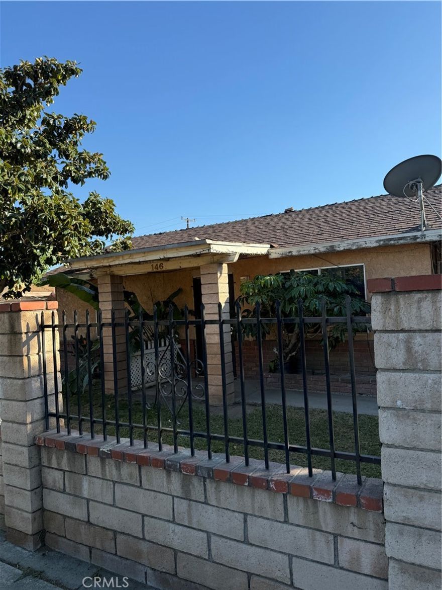 This property is completely gated with the front having masonry and wrought iron. It's in need of TLC and your touches will make it your personal styled home. The galley kitchen is situated in the middle of the home and two bedrooms to one side. The bathroom with shower is conveniently located at the end of the hall. There are gas washer and dryer hookups, a carport leading to the backyard. Close to Rancho Avenue, Colton High School and nearby Valley Boulevard to the 10 Freeway, shopping and restaurants. Make this your forever home!