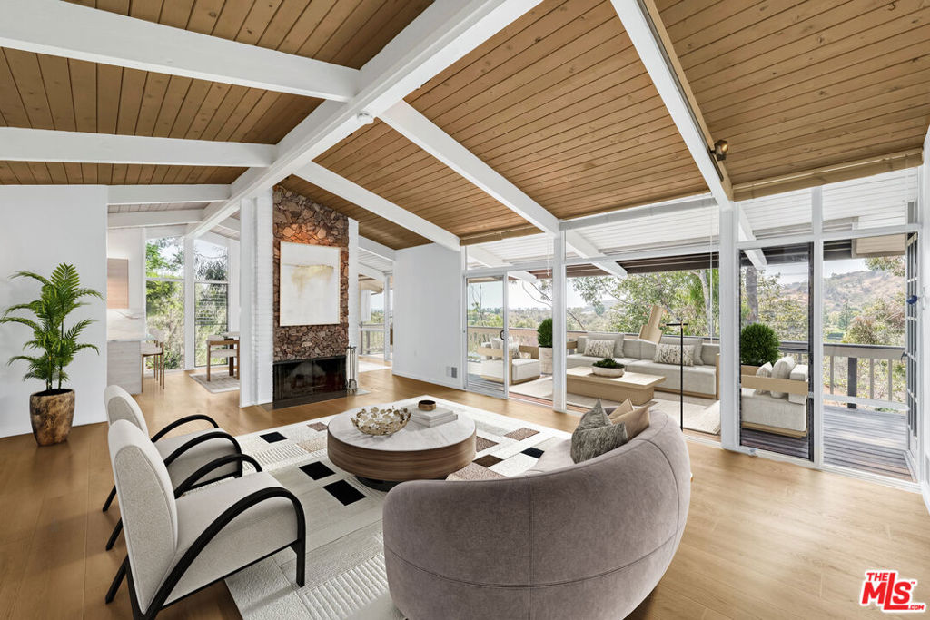 This tastefully updated mid-century ranch-style home, located in the prestigious Serra Retreat neighborhood, offers 4-bedrooms and 2 bathrooms. Featuring hardwood floors throughout, the home boasts stunning ocean and mountain views, along with convenient off-street parking. Enjoy seamless indoor-outdoor living as the primary bedroom, living room, and dining area all open onto a generous viewing deck perfect for entertaining or relaxing. The brand-new, fully remodeled kitchen combines style and functionality, making it a true centerpiece of the home. Situated in the heart of Malibu, you're just moments away from world-class shops, restaurants, and the iconic Surfrider Beach. Leases for 13 months or more.