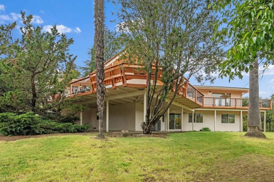 Welcome to your perfect family retreat in the beautiful Holiday Lake Estates! This inviting home offers a well-designed living space on a generous half-acre lot ideal for kids, pets, and creating lasting memories. Natural light fills the home through large windows that frame stunning views of the Diablo Mountain Range and bring the outdoors in. The open-concept main living areas feel bright and airy, perfect for everyday living and family gatherings. Downstairs there are 2 bedrooms, a full bath and a spacious open area providing the ultimate hangout spot ideal for a game room, movie nights, or an additional family room where everyone can spread out and relax. There's also a versatile bonus room off the garage with its own private entrance, perfect as a home office, workout space, or a 5th bedroom. Step outside to enjoy expansive, well-maintained decks great for outdoor dining or soaking in the peaceful views. Just a short walk from your front door is a large HOA maintained grassy meadow perfect for outdoor play, or leisurely walks with your dog. Tucked into a quiet, nature-filled neighborhood yet just minutes from town, this home offers the ideal balance of space, comfort, and convenience. Come experience the lifestyle your family will love in Holiday Lake Estates!