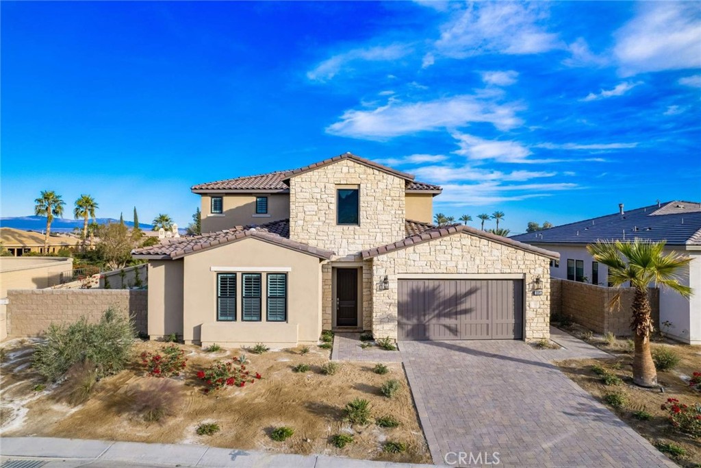Fully furnished newly built home in the prestigious gated community of Stone Creek Ranch. This model home comes fully furnished and features 5 bedrooms, 5 bathrooms, office and upstairs game room. The master bedroom is located on the first floor with a luxurious master bathroom with a soaking tub with an oversize shower. The living and Dining room boast over 20 ft ceilings with wood floors and sliding glass doors leading to the amazing entertainer's yard with a saltwater pool and spa, built-in bbq grill and outdoor fireplace with an oversized putting green with spectacular views of Coral Mountain. This home is just a few minutes to PGA West and Greg Norman public courses, and Coachella and Stagecoach festivals. This home is truly amazing and a must see.