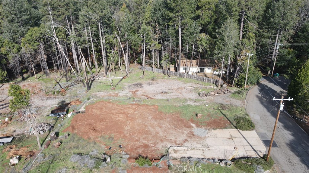 Nice Lower Magalia .25 acre lot is ready for a new owner. The home that was lost was 3 bedrooms 2 baths and 1,570 square feet. This property still has nice views of the tall evergreens of Magalia. The property is located in the Paradise Pines Home Owners Association. This association only has one annual fee of 270.00 per year. The HOA does have a clubhouse, pool, spa, meeting rooms, banquet facilities, tennis courts, bocce ball courts and numerous walking trails to creeks and flumes! This property is ready for a new Magalia resident.