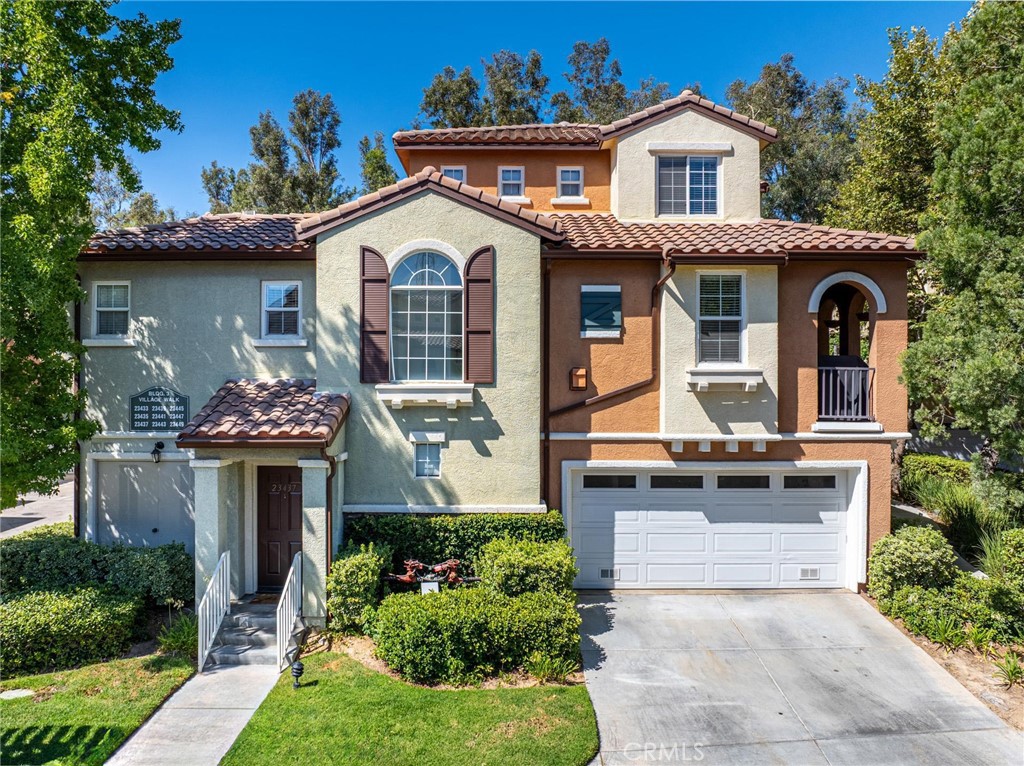 As one of the most popular townhome communities in the area, Village Walk Valencia provides an excellent location for people to enjoy nearby parks, shopping, dining and more! This particular townhome on Abbey Glen lives like a tri-level home with an attached 1-car garage on the first level. On the second level, you will find the primary bedroom, family room, dining room, full bath and a freshly painted kitchen. Stunning hardwood floors in the living and dining areas with canned lighting throughout. Covered balcony large enough for a grill and seating. Indoor laundry room with linen storage as well. The oversized secondary bedroom is the only room on the third level with plenty of natural lighting. The home also comes with an additional covered parking space. NO MELLO-ROOS and the HOA amenities include beautiful landscaping and a pool & spa only accessible to the Village Walk community. Proximity to hiking trails, bike paths, and Valencia Town Center, this is a MUST see!