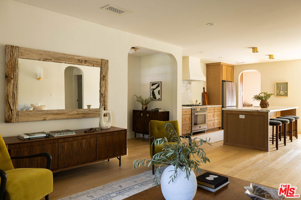 Step into a world where timeless design meets contemporary living in this impeccably re-envisioned residence. Behind its classic exterior lies a fully transformed home that balances sophistication, comfort, and innovation. The thoughtful layout offers seamless flow that caters to both intimate living and grand entertaining. Sunbeams pour through newly installed, energy-efficient windows, bathing each space in warmth and brilliance. Freshly laid White Oak wood flooring guides you through graceful interior arches and into the living room, where a plaster fireplace quietly defines the atmosphere. Every element, from the solid un-lacquered brass hardware on custom doors to the curated finishes throughout, has been thoughtfully chosen to elevate the home's aesthetic. The kitchen takes center stage as the heart of the home. A culinary atelier designed with both artistry and utility in mind. Anchored by a grand island, it showcases custom-crafted white oak cabinetry, soft-close interiors, and marble countertops that strike a perfect chord between elegance and durability. A Bertazzoni 36" range framed by a custom-designed surround hood transforms everyday cooking into a culinary experience. An adjoining dining space provides a sophisticated backdrop for gatherings that opens to a deck creating an ideal indoor-outdoor entertainers dream. The primary suite is a sanctuary of its own, thoughtfully separated by a hallway from the rest of the residence. A generous walk-in closet and 8-foot grand sliders open directly to the private outdoors. The ensuite bath evokes a spa-like retreat, with dual vanities crowned in sleek Caesarstone countertops, a separate plaster finished shower and soaking tub designed for unwinding. Marble and limestone floors add that layer of timeless sophistication underfoot. Outdoors, the transformation continues. Privacy hedges and fresh wood fencing frame a lush sanctuary, complete with an oversized wood deck which overlooks the spacious courtyard. Beyond the main residence, the property extends its thoughtful design to a private ADU, discreetly accessible through a separate entrance at the rear. Finished with the same level of craftsmanship and elegance, this self-contained retreat features its own air and heat, a full kitchen with marble countertops, spacious bath, and washer/dryer hookups, while a secluded patio and dedicated parking offer an added sense of autonomy. Versatile by design, it can serve as a refined in-law suite, a serene home office, or an income-producing opportunity, further enhancing the property's appeal and flexibility. Perfectly situated in the coveted enclave of La Tijera Village, a hidden gem comprised of just 500 homes, this residence offers not only refined living within its walls but also a true sense of community. Neighboring Ladera Heights and View ParkWindsor Hills, the area invites a lifestyle where walking or biking to Kenneth Hahn or local favorites such as Hilltop Coffee, Orleans & York, Sunday Gravy, Somerville, and Jon & Vinny's becomes part of the everyday rhythm. With LAX and the Westside only minutes away, the location balances neighborhood intimacy with seamless access to the wider city. This isn't just a residence. This is a carefully curated lifestyle for those who value design, comfort, and vision. Want perfection? You may have found it.