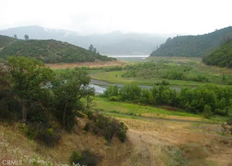 Unique property for someone who is looking to live in a national park. 5.5 Acres surrounded by the national forest/ State of CA land. You are within 3 miles of Hough Springs. The parcel overlooks the Indian Valley Reservoir. This is a gorgeous piece of property. I don't see any utilities near the land. This parcel is going to be a moto enthusiasts dream, unlimited off roading. There are 678 acres to the left and behind the lot. There is one, five-acre parcel adjacent to the property. Next to that lot and behind is another 600 acres of government land. The closest large city is Lucerne and is within a 20-minute drive to downtown. APN#016-026-140-000, GPS-39.156440 -122.567139
