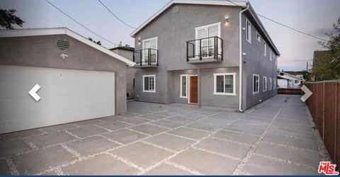 Photo of 1629 S Ridgeley Drive, Los Angeles, CA 90019 (MLS # 25621031)