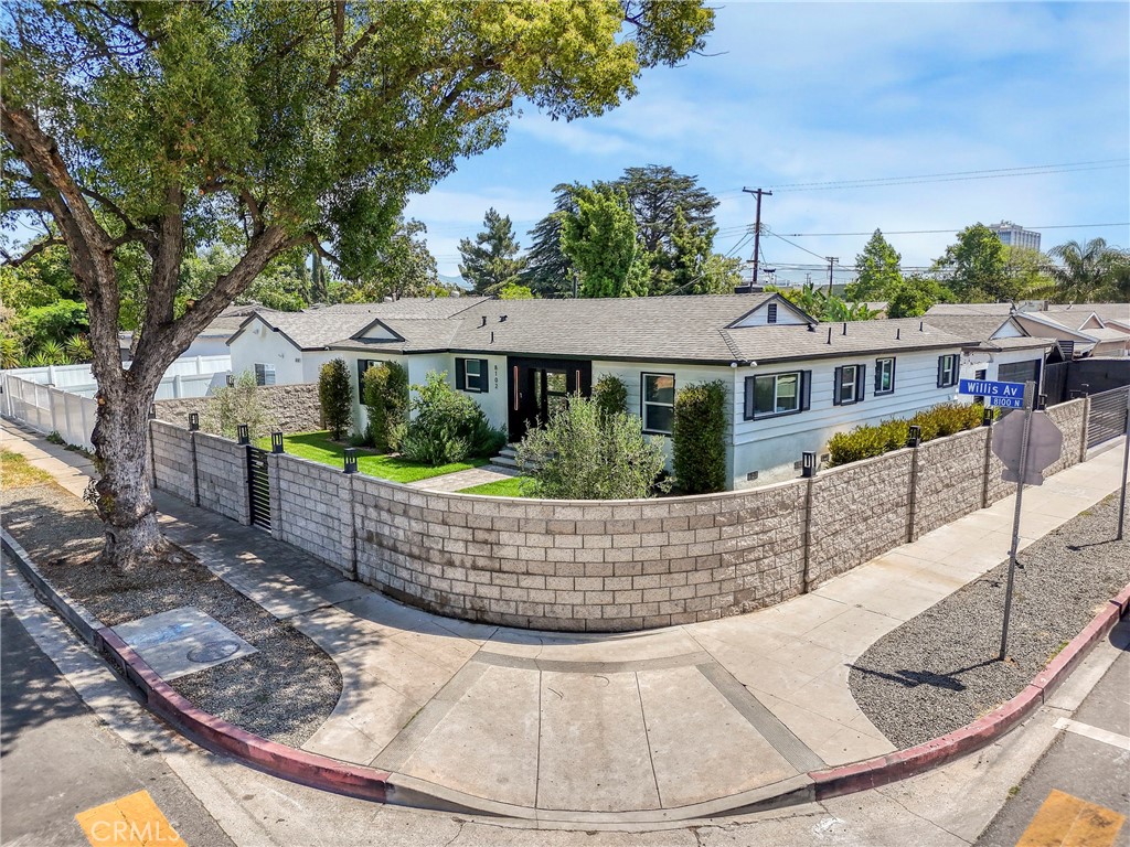 Beautifully remodeled 3-bedroom, 2-bathroom corner-lot home in Panorama City, fully gated with immaculate landscaping and true pride of ownership. A majestic olive tree graces the front yard, adding timeless charm. Tranquility can be felt both inside and out. The owner has left nothing untouched—this home has been remodeled from top to bottom. Features include recessed lighting, updated bathrooms, and a spacious living area ideal for entertaining or relaxing. The fully renovated kitchen offers great flow and comes with a new washer, dryer, and refrigerator. Enjoy a heated pool and jacuzzi for year-round enjoyment. Detached garage with epoxied floors. Property includes two city-approved detached ADU plans—each with a private entrance and separate address. One ADU is 1-bed/1-bath; the second is 2-bed/1-bath—both with kitchens and laundry hookups. Near 5, 405 & 170 freeways, shopping, Kaiser, and more.