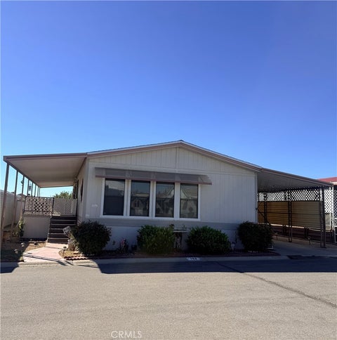 Photo of 13393 Mariposa Rd, #143 RD, Victorville, CA 92395 (MLS # HD26223961)