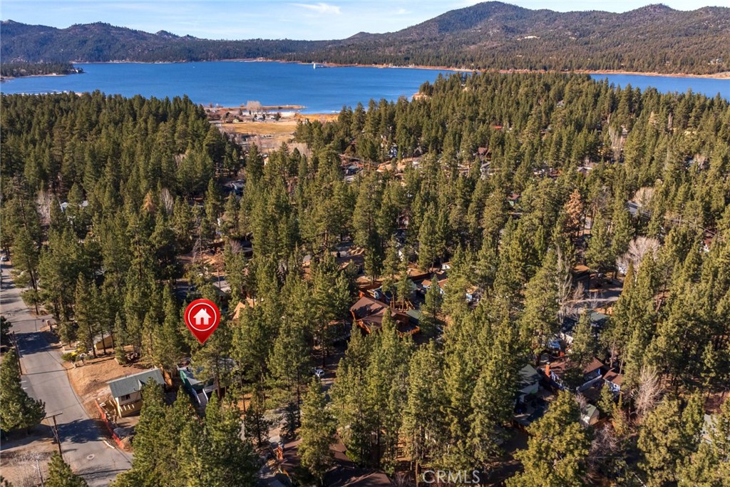 Welcome to your perfect mountain getaway! Nestled in the serene neighborhood of Big Bear Lake, surrounded by mature trees, this beautifully maintained cabin-style home offers the ideal blend of comfort, charm, and location!
Boasting 2 bedrooms and 1 bathroom, this cozy retreat features rustic wood accents, a warm fireplace, and spacious living areas filled with natural light. The kitchen offers plenty of storage and counter space, it is perfect for hosting after a day on the slopes or hiking nearby trails.
Step outside to enjoy a large deck surrounded by towering pines, perfect for morning coffee or evening relaxation under the stars. Situated just minutes from the lake, ski resorts, hiking, and village shops, this home is a prime opportunity for full-time living, weekend escapes, or vacation rental income.
Don’t miss the chance to own a piece of Big Bear’s magic.