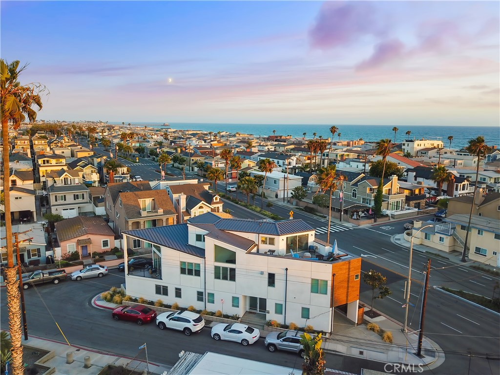 A Coastal Gem with Exceptional Value and Elegance on the Balboa Peninsula
Nestled just a gentle sea breeze from the beach and built in 2017, this magnificent Newport Beach property offers not only an impeccable coastal lifestyle but also the financial flexibility of a transferable "Newport Beach SHORT-TERM RENTAL PERMIT". Whether for personal enjoyment or rental income, this rare feature enhances its appeal.
A beacon of coastal elegance, this Balboa Peninsula treasure spans three levels, offering expansive living spaces infused with high-end luxury. Fully furnished and turnkey, the home boasts three spacious bedrooms, a versatile loft, and three sophisticated bathrooms. Every corner is meticulously crafted to ensure both beauty and functionality.
Soaring vaulted ceilings and grand windows bathe the interiors in radiant California sunshine, while wide-plank white oak floors and contemporary touches like stainless steel cable railings and stylish pendant lighting create a modern, inviting retreat.
The chef’s kitchen is a showstopper, featuring pristine quartz countertops, a large entertainment-ready island, sleek European cabinetry, and premium stainless-steel appliances. The open-plan living areas flow effortlessly, perfect for daily living and hosting.
The primary suite is a private oasis designed for relaxation, with a spa-inspired bathroom, walk-in shower, soaking tub, and spacious walk-in closet.
Outdoors, the rooftop terrace steals the show, offering panoramic views from coastline to skyline. It's ideal for sunset gatherings or quiet reflection and ready for a hot tub addition.
Built with sustainability in mind, the home features fully paid-off solar panels (2018), recessed lighting, central heating/air conditioning, and a built-in wine refrigerator.
Parking is convenient with a single-car garage and additional covered space. Located a block from the beach and within walking distance to fine dining, premier shopping, and vibrant beachside activities, this home offers not just a residence, but a sophisticated lifestyle of leisure and luxury.
Thank you for considering this extraordinary turnkey coastal sanctuary.