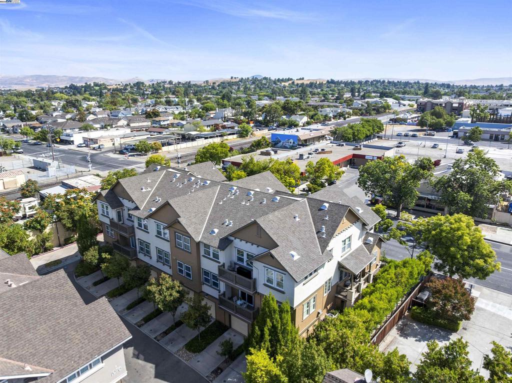 Beautiful Upgraded Corner Unit in the Heart of Downtown Livermore. This stunning upgraded corner unit is ideally located in the heart of Downtown Livermore, Station Square. The gourmet kitchen boasts quartz countertops, a custom backsplash, breakfast bar, and upgraded appliances-perfect for both everyday living and entertaining. The open floor plan features luxury wood-like flooring, triple-pane windows for soundproofing, and an abundance of natural light. Enjoy relaxing or entertaining on the private decks overlooking the vibrant downtown. Additional highlights include a two-car tandem garage with ample storage and an in-unit washer and dryer. Just a short stroll to Livermore's award winning downtown, including shops, restaurants, theaters, the ACE Train Station, and more.