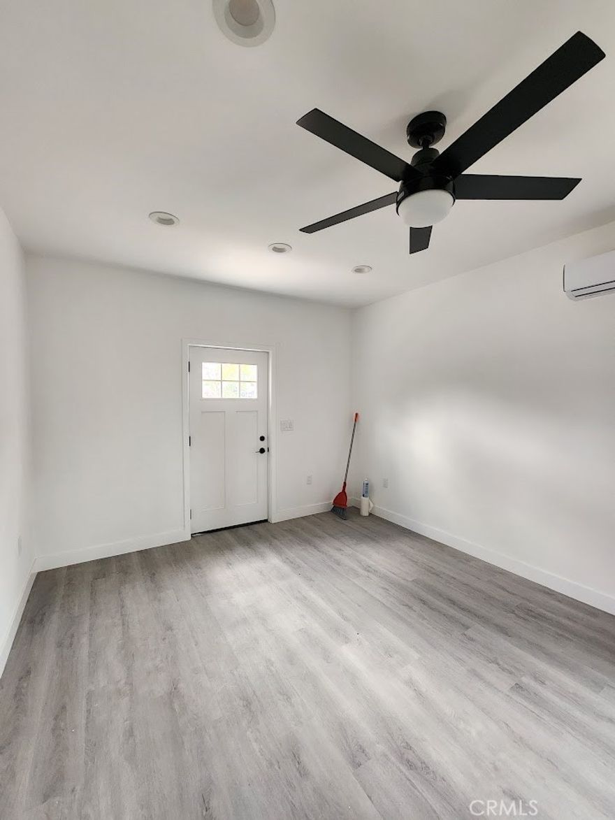 Beautiful one bedroom one bathroom home is central Corona area for rent. This home is fully remodeled with a beautiful kitchen with all appliances included. There is new vinyl plank flooring throughout and neutral paint. The laundry room is very nice and washer and dryer included. There is a small patio area off the back of the home. This home is an ADU attached to the front house.
