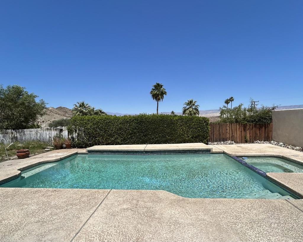 INVESTORS OPPORTUNITY! Well appointed home in the highly coveted Cathedral City Cove. New laminate floors throughout, open floor plan. This home is full of potential! Come see it today, it won't last!