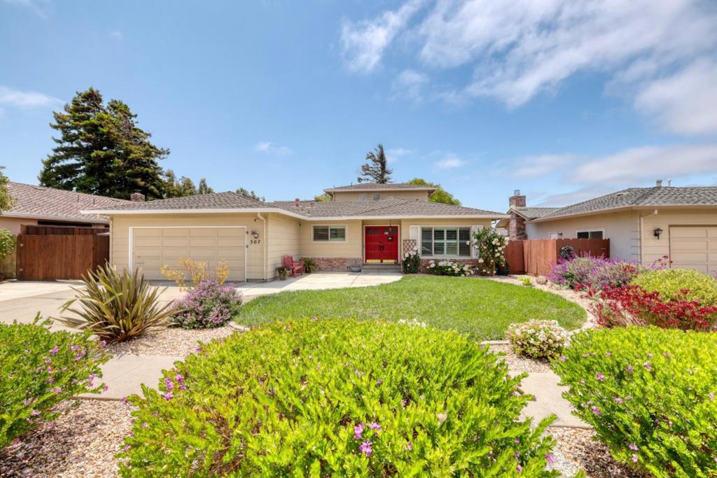 Welcome to 307 De La Vina Way in the mission park district of Salinas, where elegance meets comfort in this beautifully designed 4-bedroom, 3-bathroom home. Nestled on a quiet, wide street adorned with mature trees, this residence offers a serene escape with the uncommon quality that there are rarely cars parked on the street. Spanning 2,302 square feet, the interior boasts an abundance of natural light, enhanced by skylights and a charming sunroom. The kitchen is a chefs delight, featuring elegant granite countertops, while the bathrooms have been tastefully remodeled with exquisite quartzite. On the ground floor, you'll find two spacious bedrooms, including a luxurious primary suite with direct access to a private hot tub/spa perfect for evening relaxation. Upstairs, an additional ensuite bedroom provides ample accommodation for guests or family. The homes inviting ambiance is further accentuated by 2 cozy fireplaces, 1 in the family room and one in the formal living room. There is a generous private outdoor space, ideal for entertaining or quiet reflection. With its elegant finishes and thoughtful design, this property is a true haven for those seeking a harmonious blend of style and comfort.