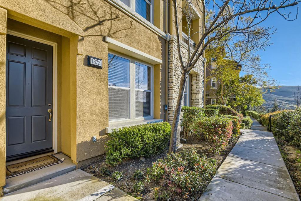 Experience the vibrant lifestyle of San Elijo Hills, where shops, cafés, dining, and trails are just steps from your door. This upgraded 3-story townhome offers a flexible first-floor office or optional third bedroom, a bright open living area with a patio to enjoy hillside views, and a spacious kitchen with granite counters ideal for entertaining. Upstairs, you’ll find two bedrooms, two full baths, and the convenience of an in-home laundry. Built in 2005 and beautifully updated, this home is ready to welcome you. One-year lease available now.