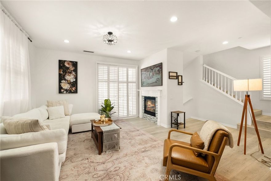 This highly upgraded and meticulously maintained end-unit townhome features 2 bedrooms, 2.5 bathrooms, and a 2-car attached garage with additional storage space. Step inside to a spacious living room featuring a custom fireplace, abundant natural light, and access to a private balcony — perfect for relaxing or entertaining. The open-concept kitchen is beautifully appointed with upgraded cabinetry, granite countertops, recessed lighting, and stainless steel appliances, seamlessly connecting to the living room. Throughout the home, you’ll find new laminate flooring, plantation shutters, and custom window coverings for a fresh, modern feel. The large primary suite boasts decorative shelving, a walk-in closet, dual vanities, and an oval soaking tub. A generous secondary bedroom includes its own full bathroom and a lovely view. Additional highlights include upgraded ceiling fans, tile flooring in the kitchen and baths, a spacious powder room, and a convenient upstairs linen closet. Enjoy the ease of direct access to a 2-car garage, plus the washer, dryer, and refrigerator are included. Located just one block from Ladera Ranch Elementary and Middle School, this home offers access to the incredible amenities of Ladera Ranch — including Founder's Park, pools, clubhouses, tennis and basketball courts, skate park, water park, dog park, scenic trails, and year-round community events. High-speed internet is included in the HOA.

*This furnished lease is move-in ready and offers the ultimate combination of comfort, convenience, and community living.
