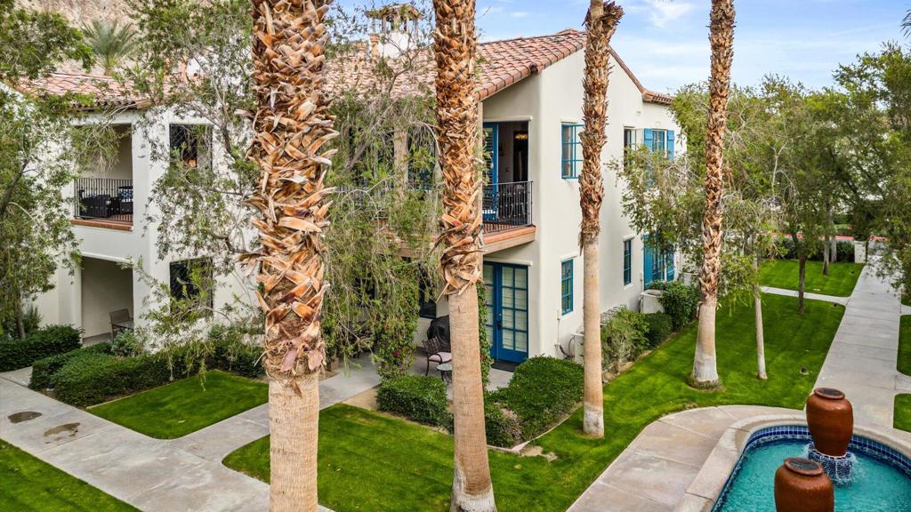 Welcome to resort-style living in the heart of La Quinta. This beautifully appointed upstairs villa offers 3 bedrooms and 3 bathrooms in a highly sought-after lock-off floor plan, ideal for both personal enjoyment and flexible rental opportunities. Thoughtfully decorated with a vibrant mix of colors and comfortable furnishings, this residence is perfectly suited as a vacation home, full-time retreat, or income-producing property.The spacious living and dining area provides an inviting setting for family gatherings or relaxing after a day of golf, tennis, hiking, or exploring the Coachella Valley. A large balcony just off the living room overlooks a tranquil greenbelt and features outdoor seating, making it the perfect spot for morning coffee or evening cocktails.Two primary suites each enjoy private entrances, offering exceptional privacy for guests. Both include king beds, en-suite bathrooms with dual vanities, walk-in showers, and soaking tubs. The larger suite features its own private balcony with serene views--an ideal place to unwind. The third bedroom includes a queen bed, generous closet space, and easy access to the third full bathroom.Located within Legacy Villas, the valley's premier residential resort community, this property places you just a short stroll from the clubhouse and main pool area. The community offers 12 sparkling pools, 11 spas, a fitness center, and beautifully landscaped grounds surrounded by the Santa Rosa Mountains. Whether you're looking for a personal desert escape, a family-friendly retreat, or a versatile investment, this villa combines comfort, style, and unmatched resort amenities.