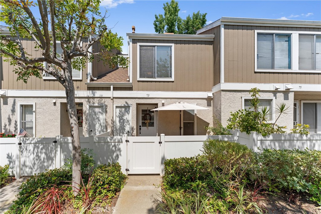 Welcome to 73 Abbeywood, a beautifully renovated townhome in the highly desirable Morningside community of Aliso Viejo! This charming 2-bedroom, 1-bathroom home offers 918 square feet of modern living space with no neighbors above or below, ensuring privacy and tranquility. Beyond a private and inviting front patio, step inside to discover stunning LVP flooring throughout, a light and bright open concept floor plan, and a spacious Great Room featuring both living and dining areas, accented by a stylish TV wall and convenient access to the private back patio. The Kitchen is a dream with sleek stainless steel appliances, elegant granite countertops, and ample cabinetry - with a handy pass-through to the Great Room. Upstairs, enjoy the spacious Primary Suite with vaulted ceilings and a private balcony, perfect for relaxing outdoors. The secondary Bedroom is also spacious and boasts ample natural light. The remodeled bathroom offers a fresh, modern touch, and the home includes a convenient office closet, as well as an in-unit washer and dryer. Step outside to a private covered patio, an ideal spot for enjoying the beautiful Southern California weather. With 2 designated parking spots, walking distance to the community pool and spa, and close proximity to parks, shopping, dining, and schools, this home truly has it all. Plus, no Mello Roos and low HOA dues! Don’t miss your chance to call this turn-key townhome yours! Call today to schedule a tour!